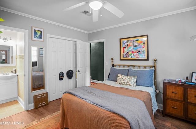 1508 London Ave, Port Royal, SC 29935 - bedroom featuring crown molding, wood finished floors, a closet, ensuite bathroom, and ceiling fan