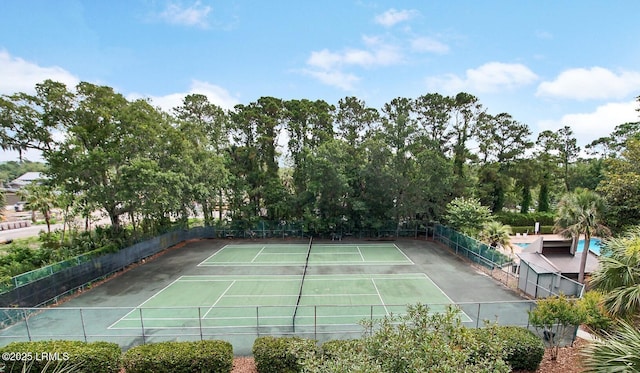 view of sport court with fence