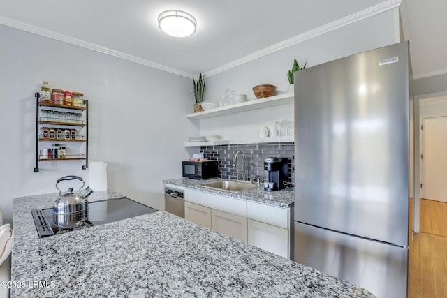 kitchen with open shelves, backsplash, appliances with stainless steel finishes, ornamental molding, and a sink