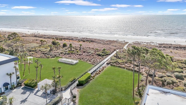 birds eye view of property with a view of the beach and a water view