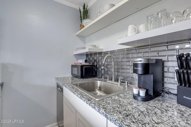 kitchen featuring open shelves, tasteful backsplash, stainless steel dishwasher, ornamental molding, and a sink