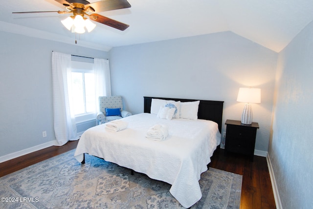 bedroom featuring baseboards, wood finished floors, ceiling fan, and lofted ceiling