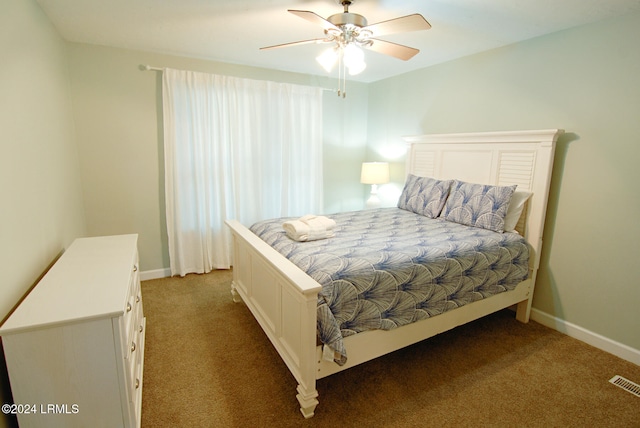 carpeted bedroom with baseboards and a ceiling fan