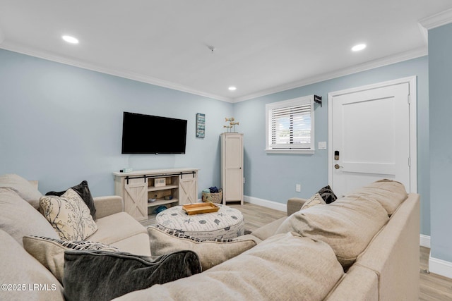 living room with crown molding and light hardwood / wood-style flooring