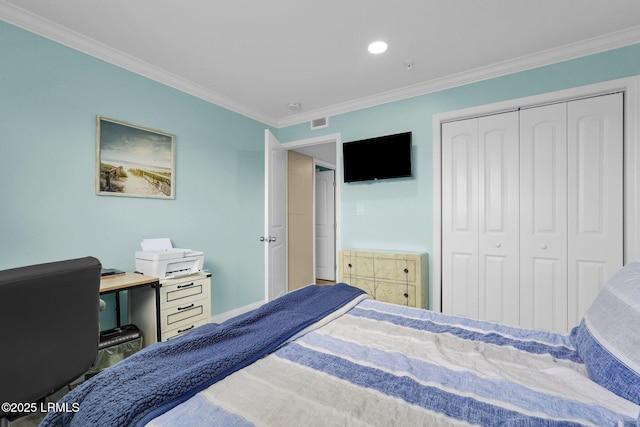 bedroom featuring ornamental molding and a closet