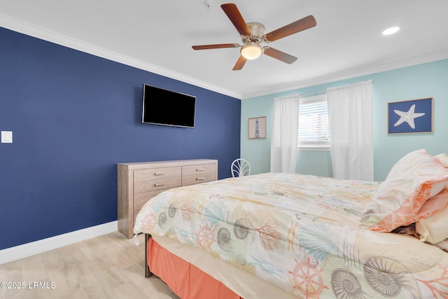 bedroom featuring crown molding, ceiling fan, and light hardwood / wood-style floors