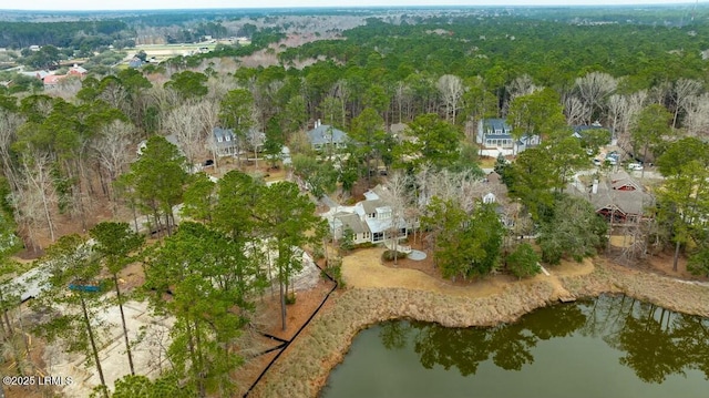 bird's eye view with a water view and a view of trees