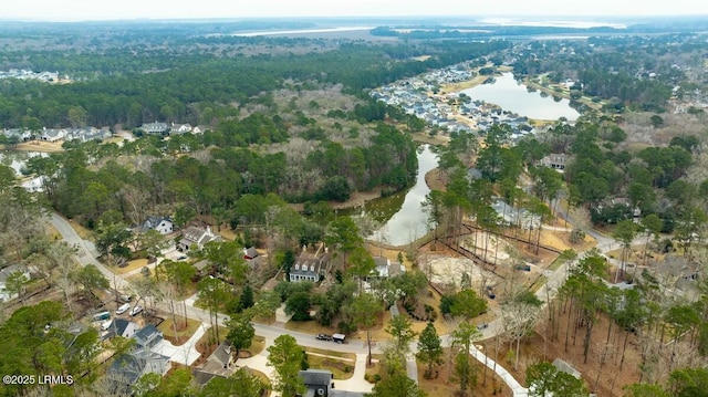 aerial view featuring a water view and a forest view