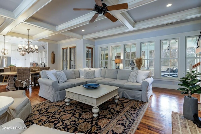 living room featuring coffered ceiling, a healthy amount of sunlight, beamed ceiling, and wood finished floors