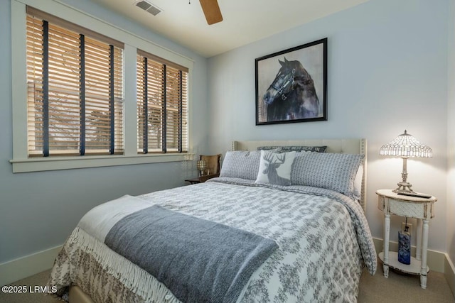 bedroom featuring carpet floors, ceiling fan, visible vents, and baseboards