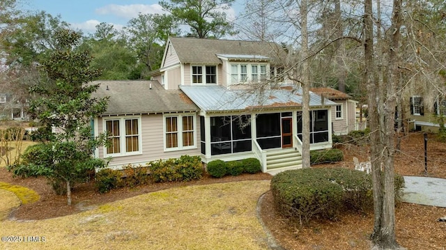 view of front of property with a sunroom