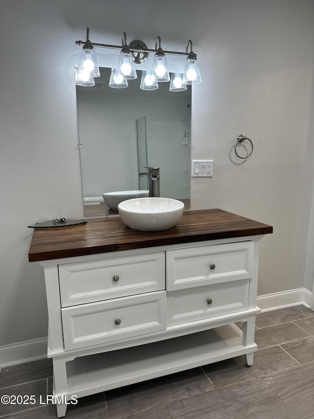 14007 Kader St, Beaufort, SC 29906 - bathroom featuring baseboards and vanity