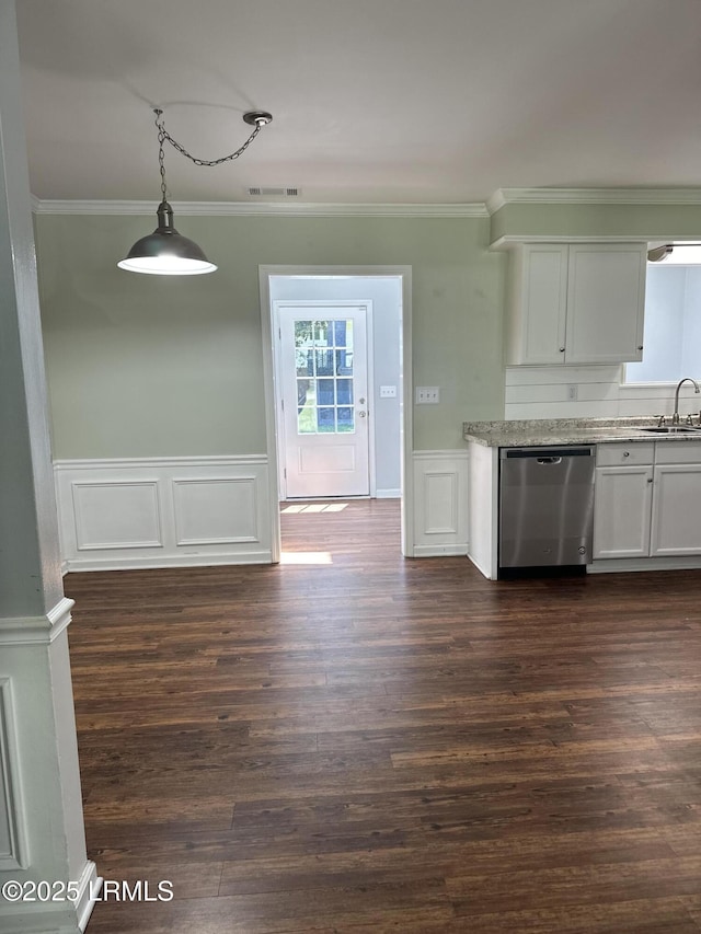 14007 Kader St, Beaufort, SC 29906 - kitchen featuring stainless steel dishwasher, crown molding, white cabinets, wainscoting, and dark wood-style flooring