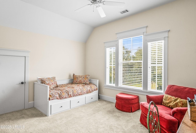 carpeted bedroom featuring visible vents, ceiling fan, baseboards, and lofted ceiling