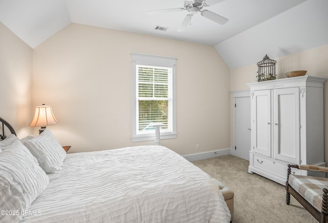 bedroom featuring lofted ceiling, a ceiling fan, visible vents, and light carpet