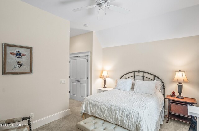 bedroom featuring ceiling fan, baseboards, vaulted ceiling, carpet floors, and a closet