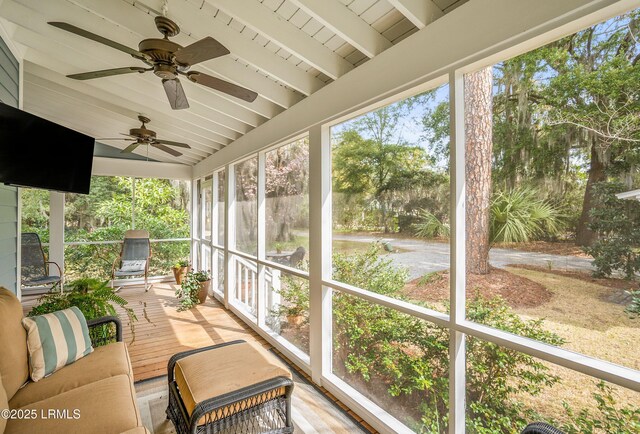 sunroom / solarium featuring lofted ceiling and wooden ceiling