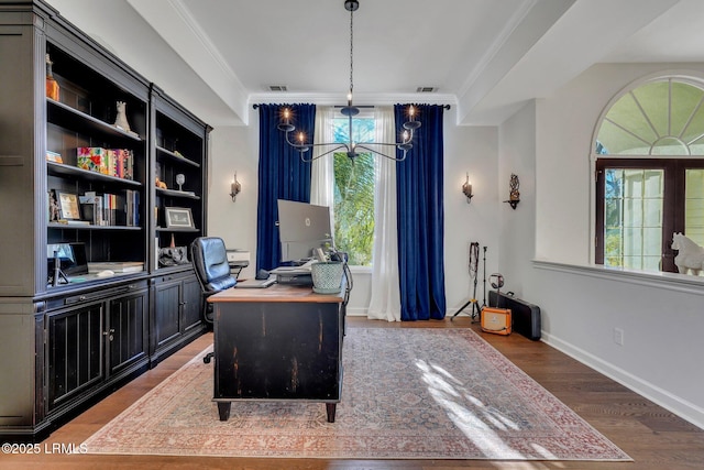 office featuring hardwood / wood-style flooring, ornamental molding, and a notable chandelier