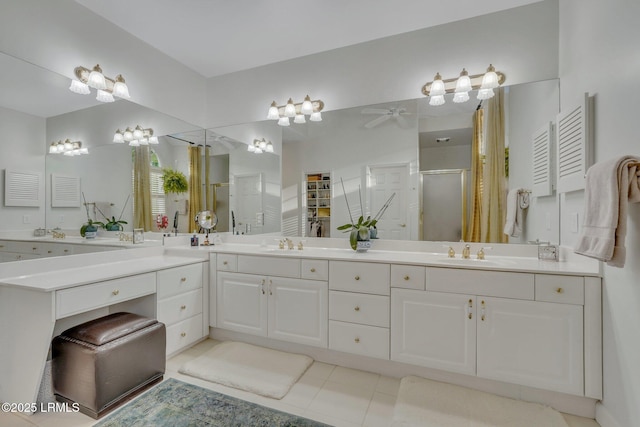 bathroom with tile patterned flooring, vanity, and an enclosed shower