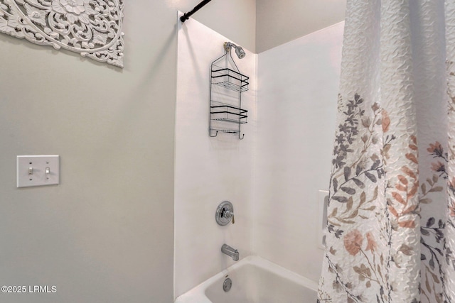 bathroom with shower / tub combo