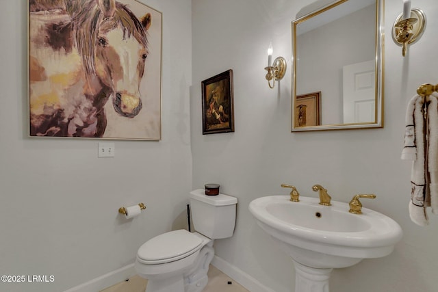 bathroom with sink, tile patterned floors, and toilet