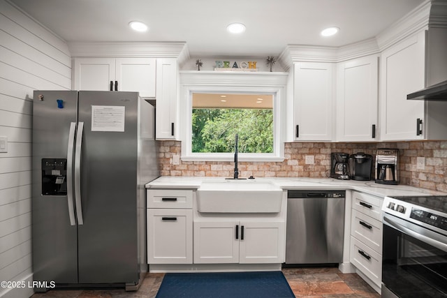 738 Marlin Dr, Fripp Island, SC 29920 - kitchen featuring stainless steel appliances, a sink, white cabinetry, and light stone countertops