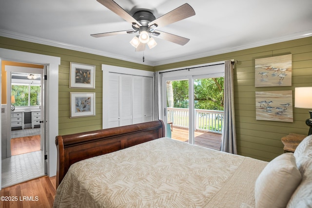 738 Marlin Dr, Fripp Island, SC 29920 - bedroom featuring wood finished floors, access to outside, crown molding, wood walls, and ceiling fan
