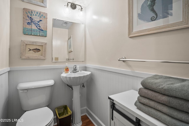 738 Marlin Dr, Fripp Island, SC 29920 - half bath featuring a wainscoted wall and toilet