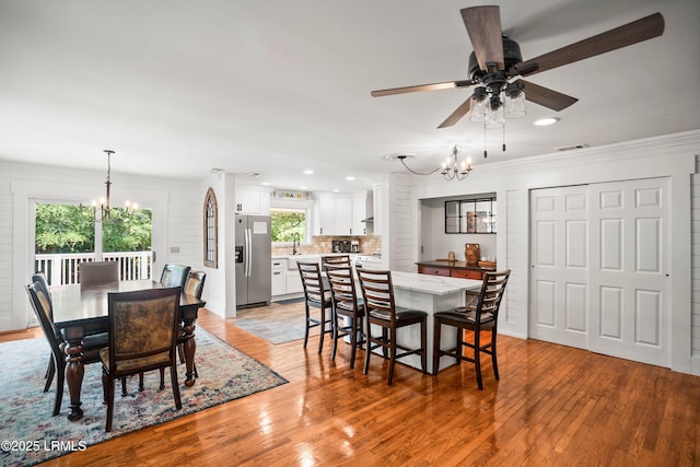 738 Marlin Dr, Fripp Island, SC 29920 - dining space with a chandelier, a ceiling fan, light wood-style floors, recessed lighting, and ornamental molding