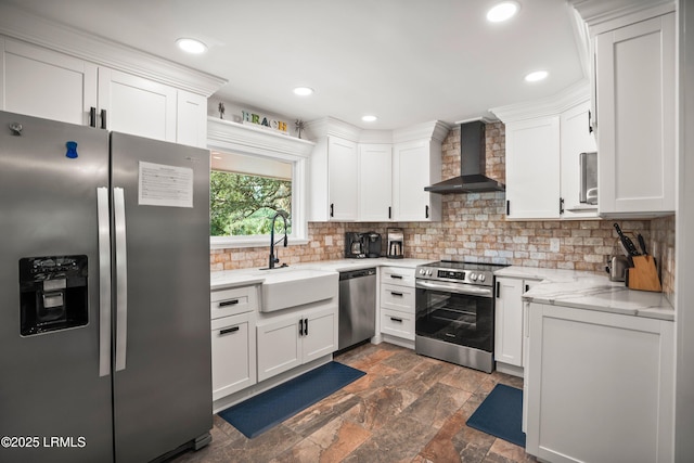 738 Marlin Dr, Fripp Island, SC 29920 - kitchen with stainless steel appliances, wall chimney exhaust hood, a sink, white cabinetry, and recessed lighting