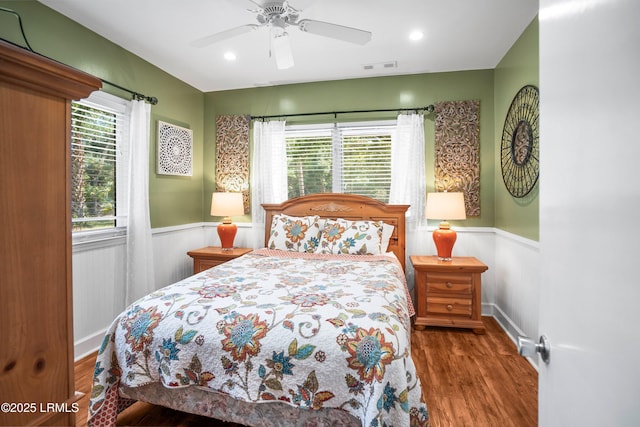 738 Marlin Dr, Fripp Island, SC 29920 - bedroom with wood finished floors, wainscoting, recessed lighting, and ceiling fan
