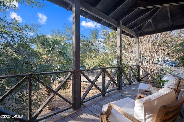 wooden deck featuring outdoor lounge area