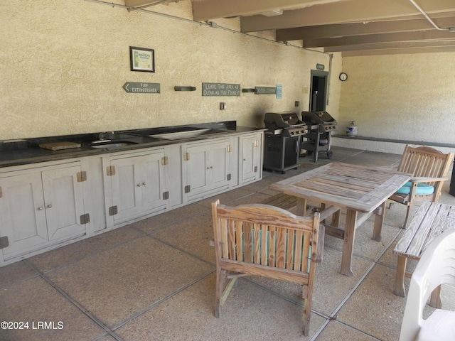 view of patio / terrace with grilling area and sink