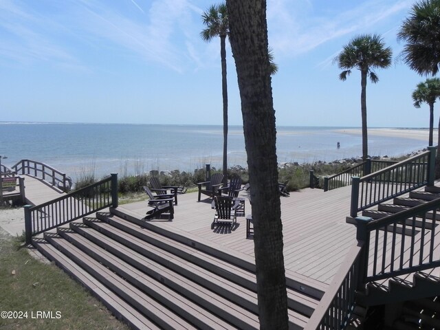 wooden deck featuring a water view