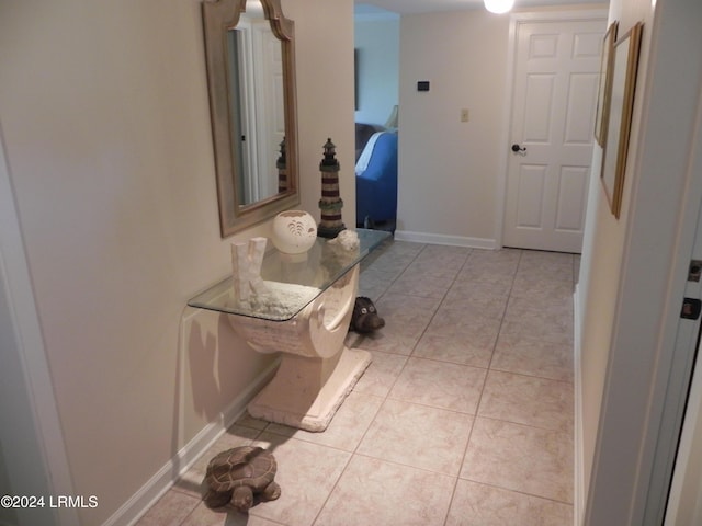 hallway featuring light tile patterned floors