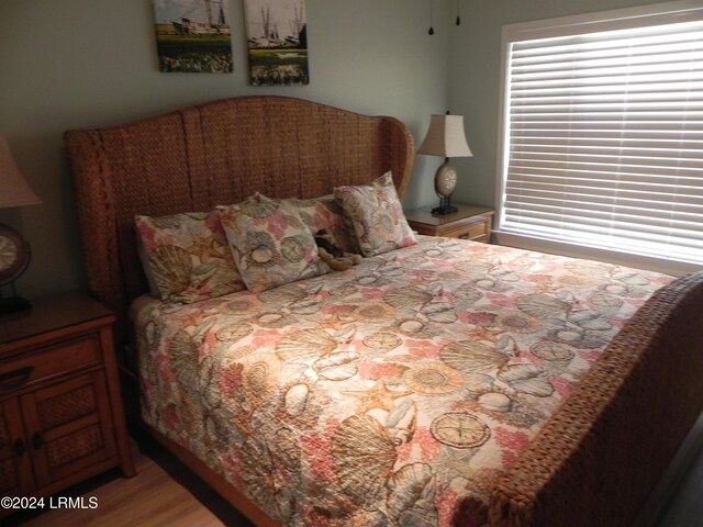 bedroom with wood-type flooring