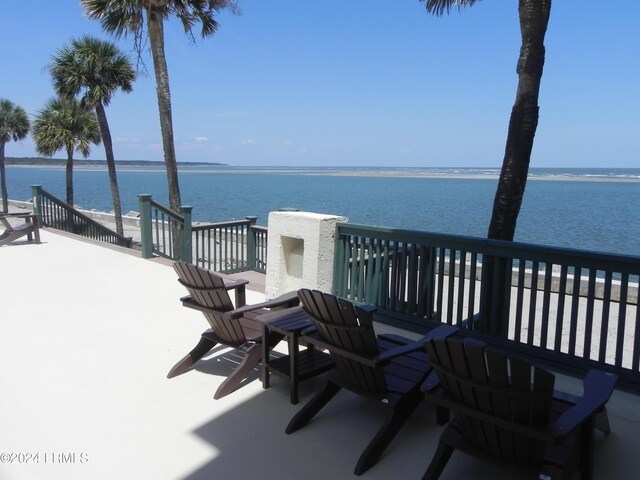 wooden deck with a water view