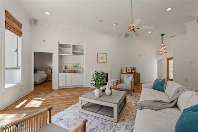 419 Bb Sams Dr, Saint Helena Island, SC 29920 - living area featuring plenty of natural light, ceiling fan, crown molding, recessed lighting, and light wood-style flooring