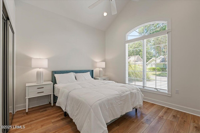 419 Bb Sams Dr, Saint Helena Island, SC 29920 - bedroom with hardwood / wood-style flooring, baseboards, high vaulted ceiling, a ceiling fan, and recessed lighting
