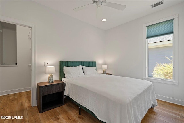 419 Bb Sams Dr, Saint Helena Island, SC 29920 - bedroom featuring wood-type flooring, baseboards, multiple windows, and recessed lighting