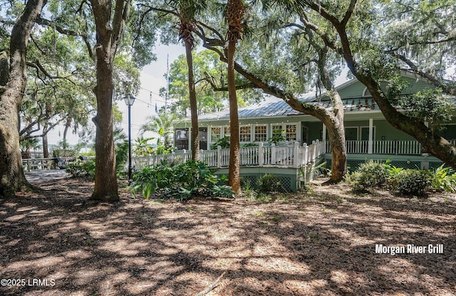 419 Bb Sams Dr, Saint Helena Island, SC 29920 - rear view of house featuring a porch and metal roof