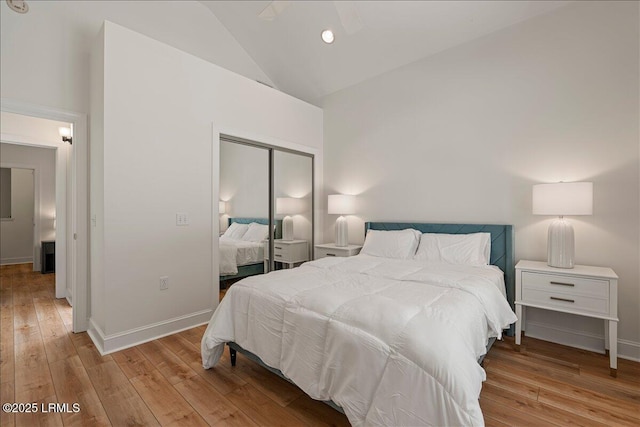 419 Bb Sams Dr, Saint Helena Island, SC 29920 - bedroom with high vaulted ceiling, a closet, wood-type flooring, baseboards, and recessed lighting