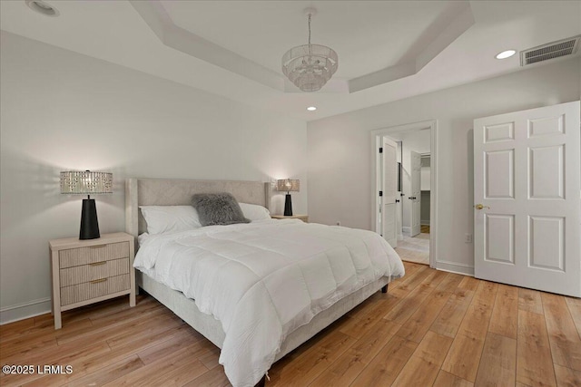 419 Bb Sams Dr, Saint Helena Island, SC 29920 - bedroom with a raised ceiling, light wood-type flooring, baseboards, and recessed lighting