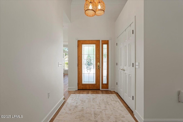 419 Bb Sams Dr, Saint Helena Island, SC 29920 - foyer featuring wood finished floors, a chandelier, and baseboards