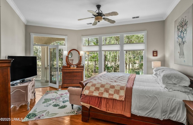 bedroom featuring crown molding, access to outside, ceiling fan, and light hardwood / wood-style flooring