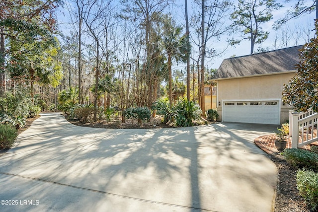 view of side of property featuring a garage