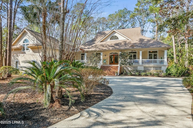 64 Osprey Cir, Okatie, SC 29909 - view of front of home with covered porch and stucco siding