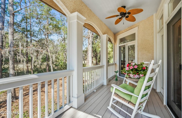 sunroom with lofted ceiling, a healthy amount of sunlight, and ceiling fan