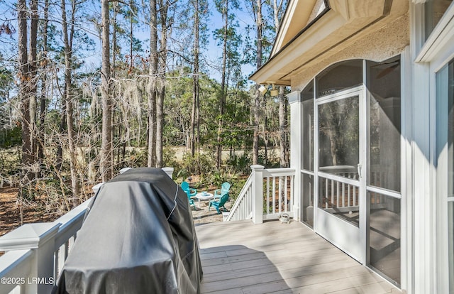 64 Osprey Cir, Okatie, SC 29909 - wooden terrace with a sunroom, a grill, and view of scattered trees