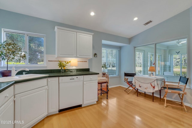 15 Padgett Dr, Bluffton, SC 29909 - kitchen with white cabinetry, dishwasher, sink, ceiling fan, and light hardwood / wood-style flooring